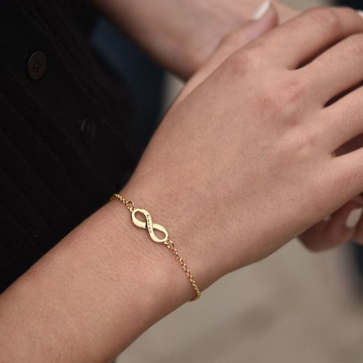 00-1004 Pulsera en oro de 18k en forma del signo infinito y ajustable en dos medidas