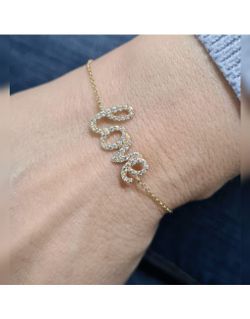 00-1034 Pulsera oro de 18K con motivo love montada con pavé de circonitas