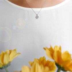 03-123163 Colgante de oro blanco rosetón con diamantes