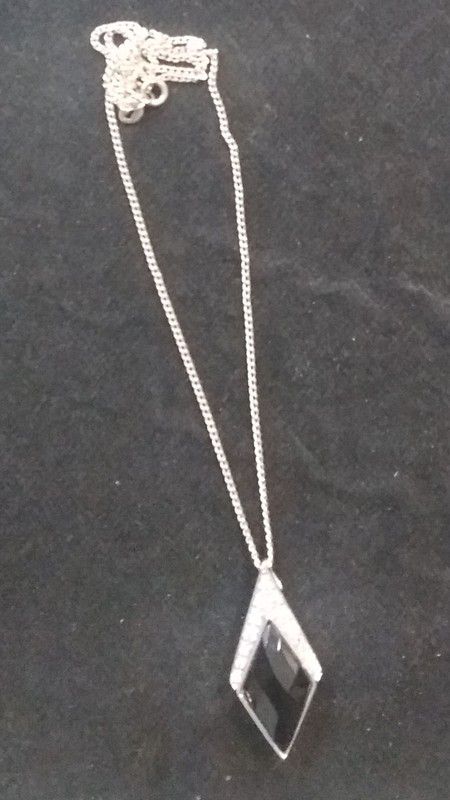 Colgante en plata de ley ónix facetado y circonitas