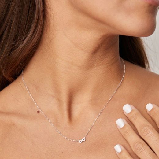 Gargantilla oro blanco 18K motivo Infinito con circonitas