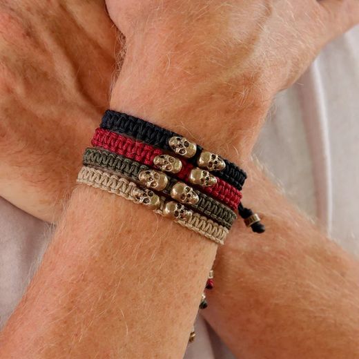SB122B Pulsera Plata de Palo unisex autoajustable de nylon beige con dos calaveras de bronce colección Cressan